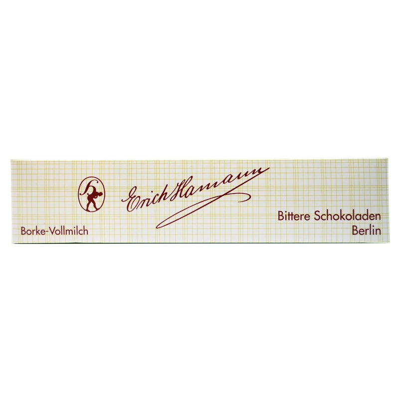 Verpackung der Erich Hamann Borkenschokolade Vollmilch – schmale rechteckige Schachtel mit klassischem Gittermuster, roter Handschrift und Berliner Manufaktur-Logo.