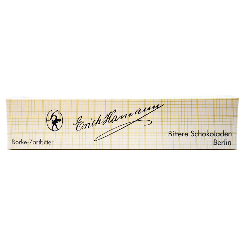 Verpackung der Erich Hamann Borkenschokolade Zartbitter – rechteckige Schachtel im klassischen Gitterdesign mit schwarzer Schrift und Berliner Manufaktur-Logo.