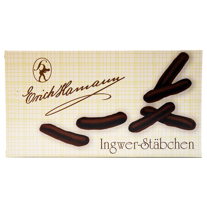 Erich Hamann Ingwer-Stäbchen 100 g – klassische Geschenkverpackung mit Gittermuster und brauner Handschrift. Edelbitterschokolade umhüllt kandierte Ingwerstreifen – handgefertigt in Berlin-Wilmersdorf.
