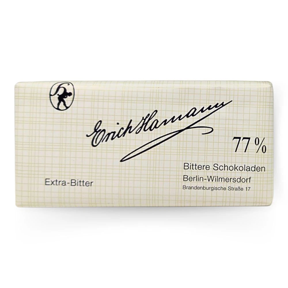 Erich Hamann Extra-Bitter Schokolade 100 g – klassische Berliner Tafelschokolade mit 77 % Kakaoanteil, verpackt in cremefarbener Gitterpapierhülle mit schwarzer Handschrift.