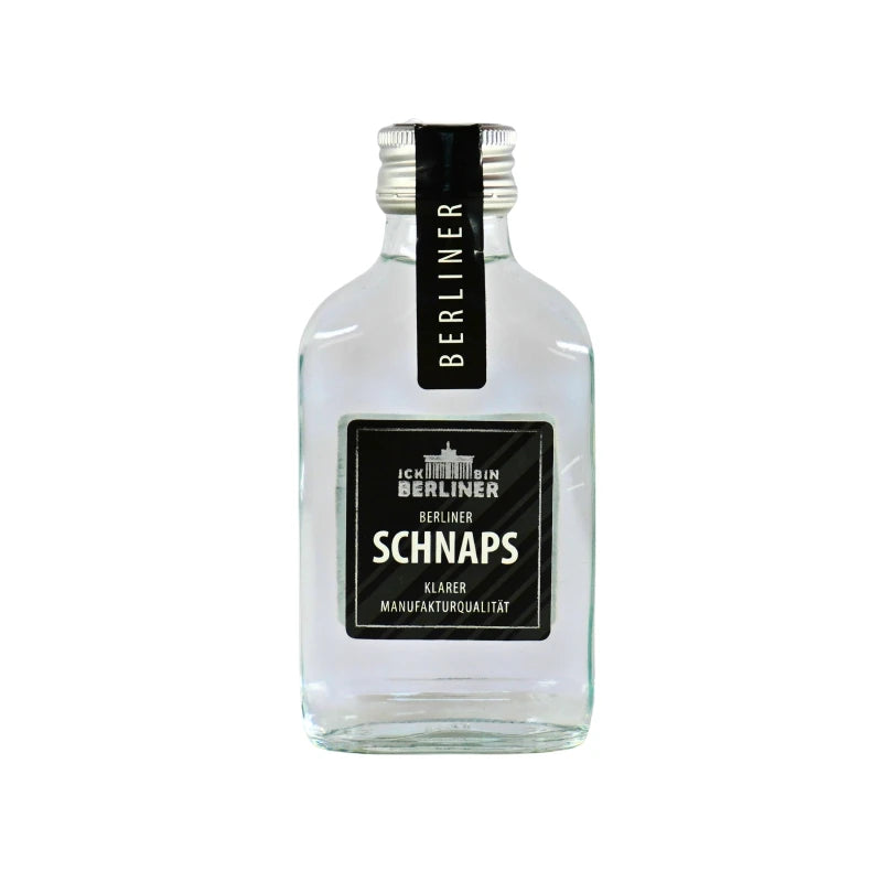 Kleine Glasflasche mit Berliner Schnaps, klarer Spirituose in 0,1 l, schwarzes Etikett mit weißer Schrift und Berliner Wahrzeichen.