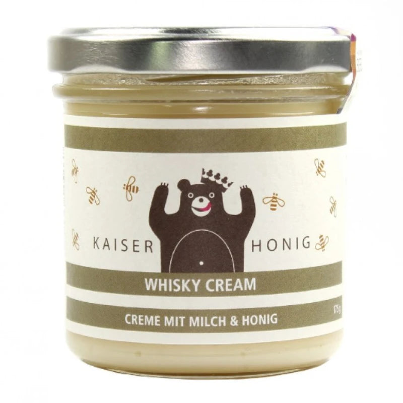 Kaiserhonig Whisky Cream im 175g-Glas, cremefarbene Milch-Honig-Creme mit olivgrünem Etikett, verziert mit Bienenmotiven und dem ikonischen Bären mit Krone.
