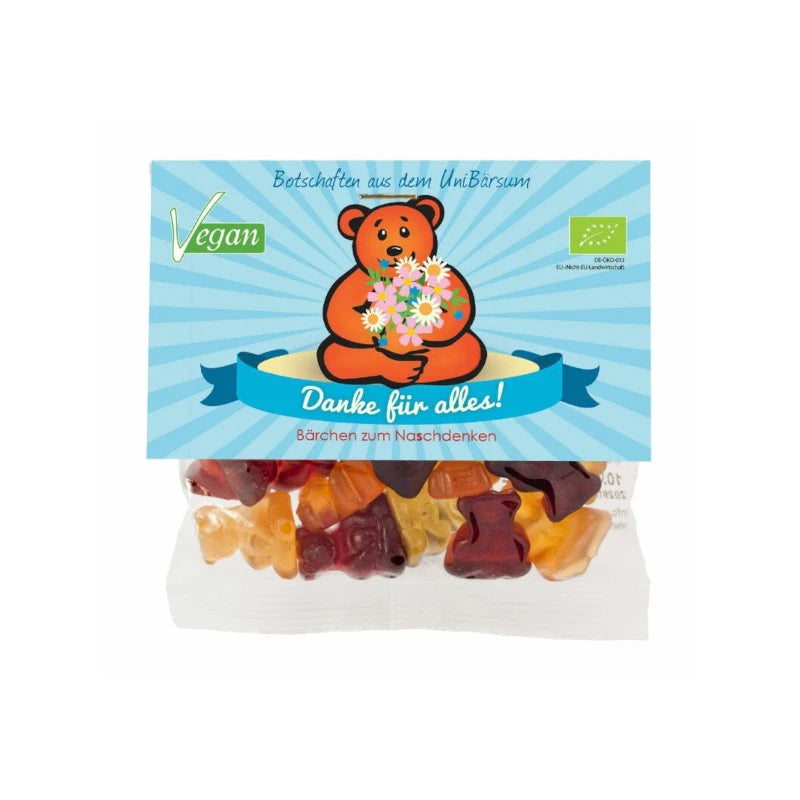 Mind Sweets Danke für alles! – vegane Bio-Fruchtgummis im 50 g Beutel mit herzlichem Motiv: ein Bär hält einen Blumenstrauß vor blauem Hintergrund. Süße Botschaft aus Berlin zum Verschenken.