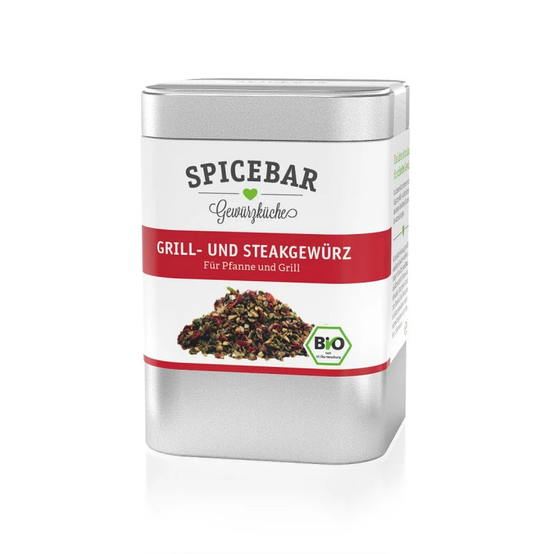 Metalldose mit rotem Etikett von Spicebar, darauf steht "Grill- und Steakgewürz – Für Pfanne und Grill", darunter ist ein Haufen grober Gewürzmischung abgebildet; Bio-Logo auf der Vorderseite sichtbar.