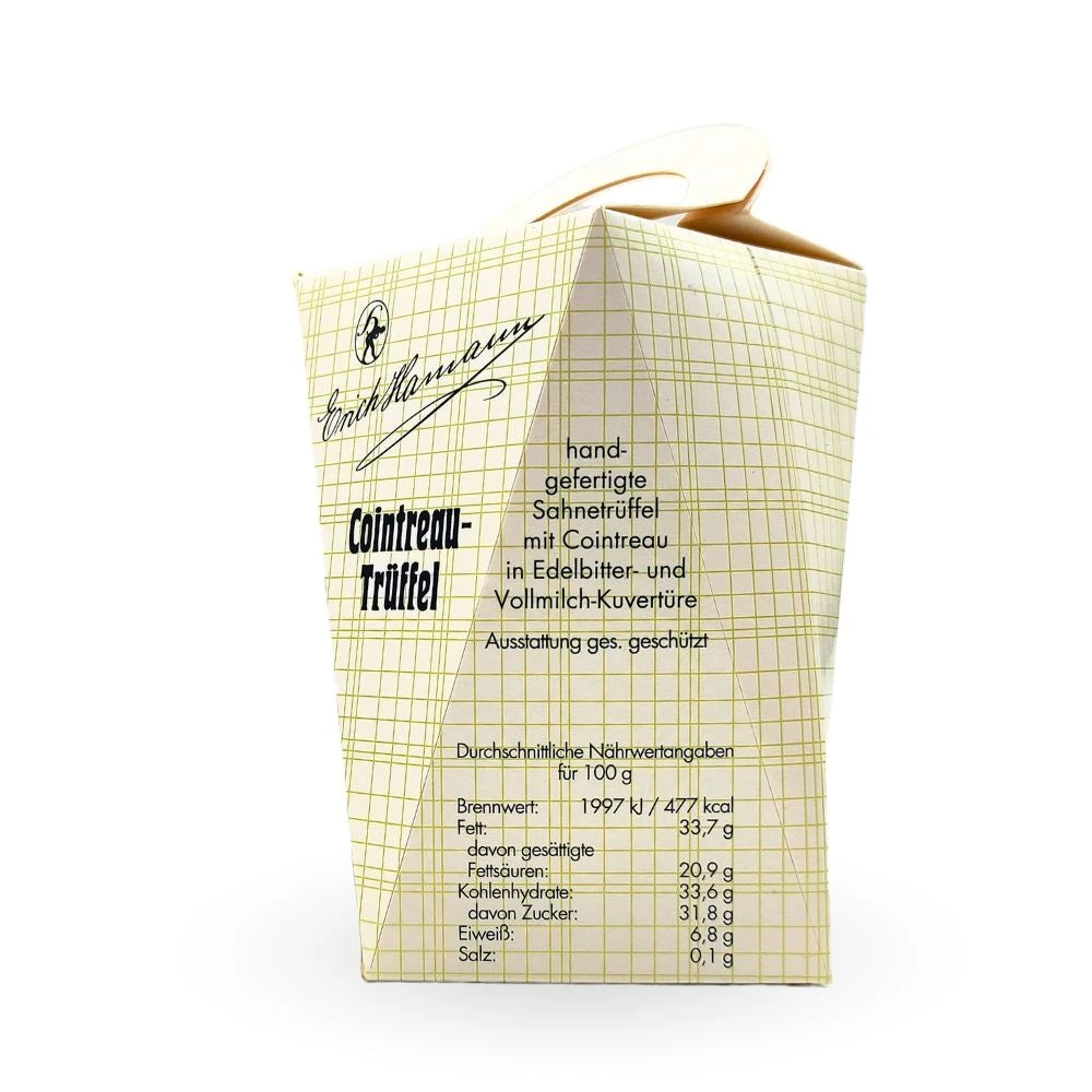 Rückseite der Verpackung der Erich Hamann Cointreau-Trüffel mit Beschreibung: handgefertigte Sahnetrüffel mit Cointreau in Edelbitter- und Vollmilch-Kuvertüre, sowie Nährwertangaben pro 100 g.
